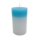 Blue-to-white gradient pillar candle with a centered wick, photographed on a white background.