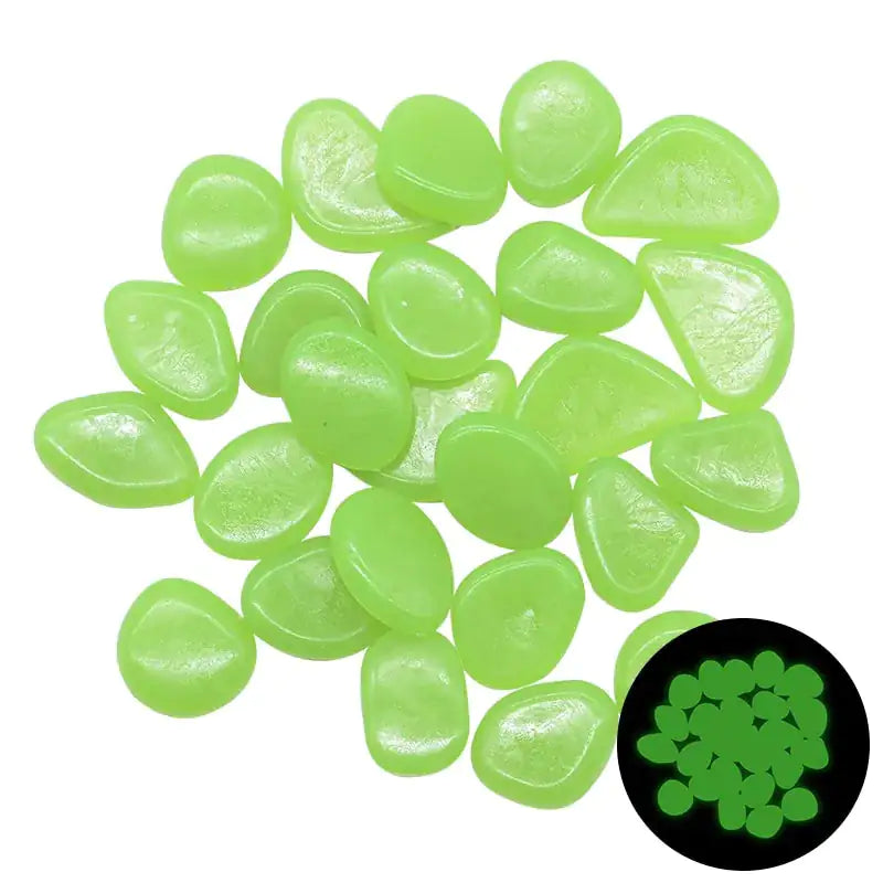 Pile of small translucent light-green glow pebbles on a white background, with an inset showing them glowing bright green in the dark.