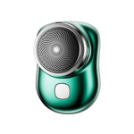 Green electric fabric shaver with a round metal shaving head and front power button.