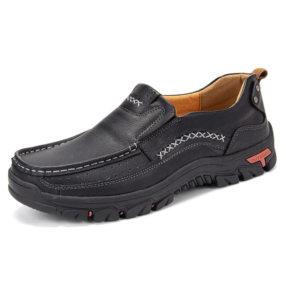Black slip-on outdoor loafers with contrast stitching and a rugged chunky sole.