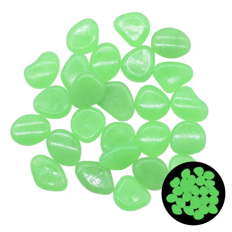 Pile of small glow-in-the-dark green pebbles on a white background, with a circular inset showing them glowing.
