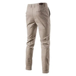 A pair of slim-fit pants with a button closure, belt loops, and side pockets. The fabric appears to be lightweight, suitable for casual or semi-formal wear.