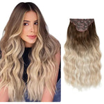 Side-by-side image of a woman with long, wavy ombré hair transitioning from dark brown at the roots to blonde at the ends, alongside a matching ombré hair extension piece on a white background.