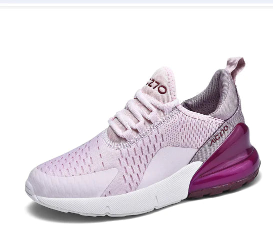 Light pink lace-up trainers with a white sole and purple heel accent.