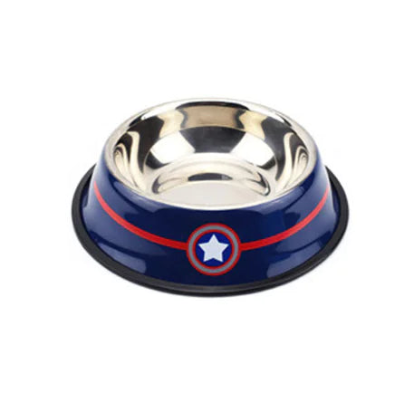 A stainless steel pet bowl with a blue outer rim featuring a red stripe and a white star emblem, resembling a superhero-inspired design. The bowl has a non-slip black rubber base for stability and is designed for feeding pets like dogs or cats.