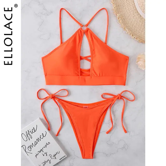 An orange two-piece bikini set laid flat on a light marble surface, featuring a strappy halter-style top with crisscross back straps and matching tie-side bottoms; “ELLOLACE” branding appears along the left edge.