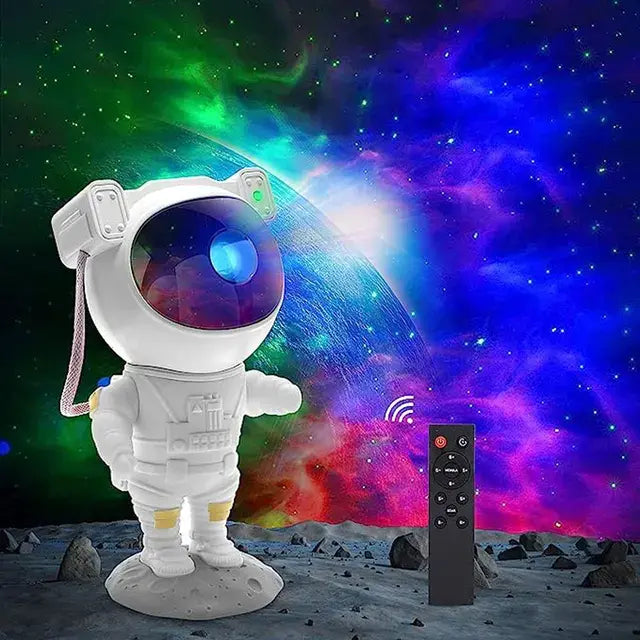 White astronaut-shaped galaxy projector lamp on a moon-like base, shown against a colorful nebula star background, with a black remote control displayed beside it.