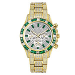 Gold-tone rhinestone-covered wristwatch with a multicolor gem bezel and matching jeweled bracelet band, featuring three subdials on the face.