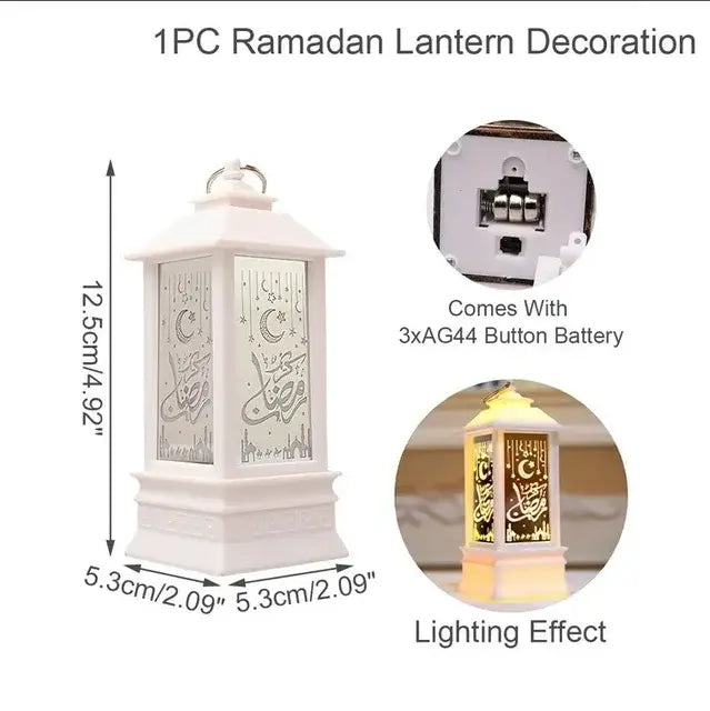 A white Ramadan lantern decoration with cutout panel details, shown with its dimensions, battery compartment, and illuminated lighting effect.