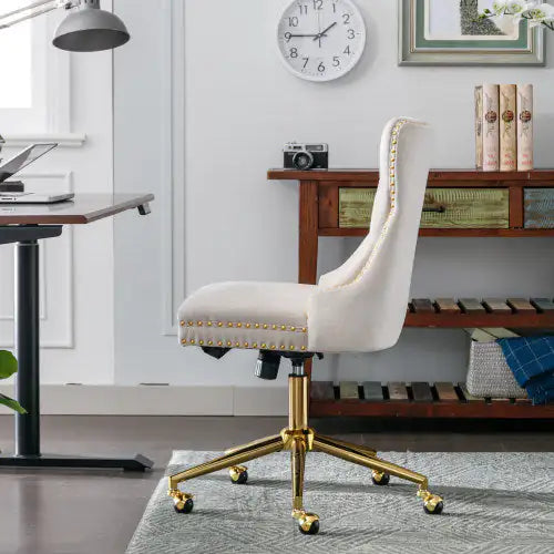 White office chair with gold accents in a home office setting