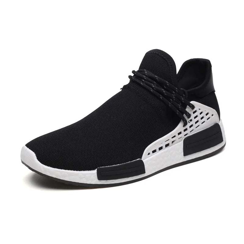 A black athletic sneaker with a breathable mesh upper, lace-up front, and a white midsole featuring black and white cage-style side support details.