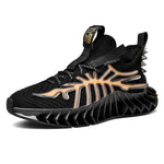 Black athletic sneaker with a chunky ridged sole and tan, branch-like side overlay, shown in a side view on a white background.