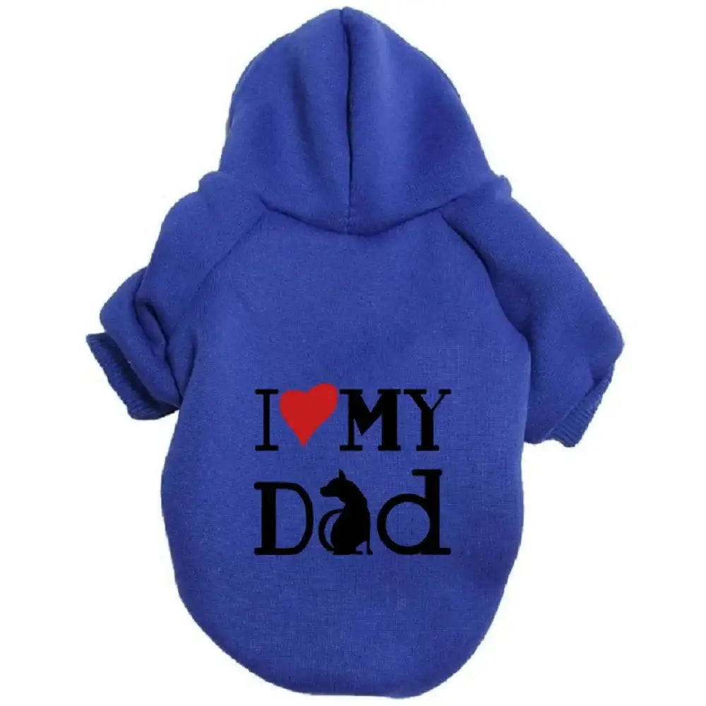 A pet hoodie with a hood and short sleeves, featuring the text 'I ❤️ MY DAD' printed on the back. The word 'Dad' includes a silhouette of a sitting dog integrated into the letter 'M'.