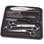 Haircutting tool kit in a zippered case, including two silver hair scissors (one thinning shears), a black comb, and a rainbow-finish straight razor, arranged on a black interior.
