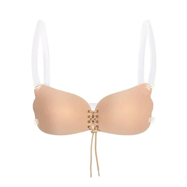Nude adhesive strapless bra with a front clasp and smooth seamless cups.