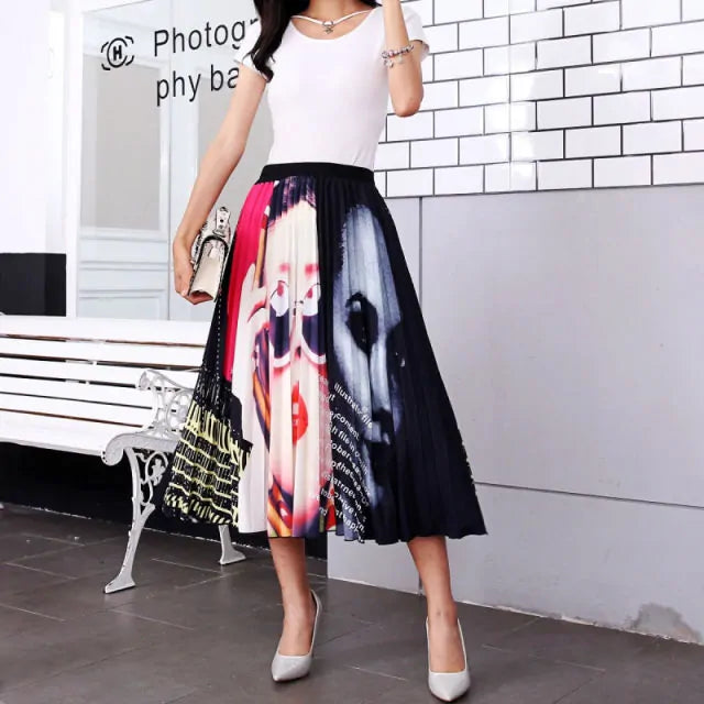 Pleated midi skirt with a gradient design, transitioning from dark black at the waistband to a soft blush pink at the hem, hanging on a black clothing rack next to a vintage-style camera.