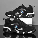 Black athletic trainers with white sole accents and logo graphics.