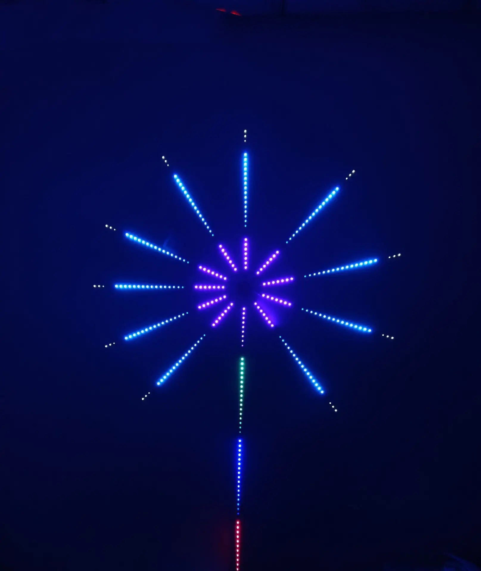 Blue and purple LED firework starburst wall light.
