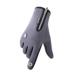 Gray full-finger sports glove with a wrist zipper, small logo patch on the back of the hand, and a touch-screen symbol printed on the index finger.