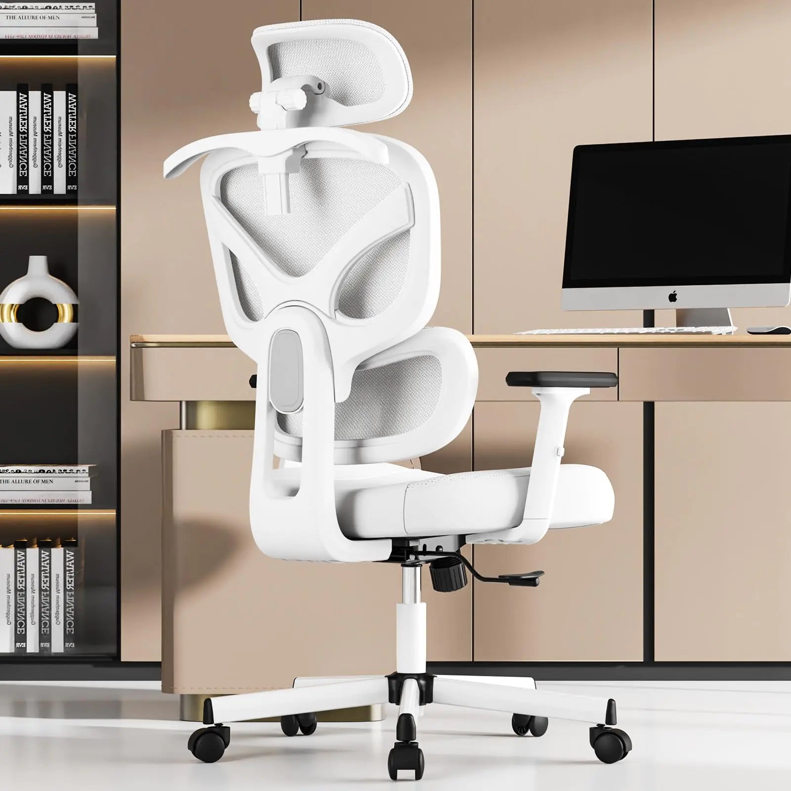 White office chair in a modern office setting with a desk and computer monitor.