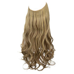 Long wavy blonde hair extension weft with darker lowlights and loose curls at the ends, shown on a white background.