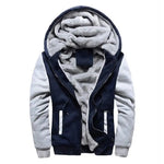 Navy hooded jacket with light gray sleeves, white-trim zip pockets, and thick gray sherpa-style lining.