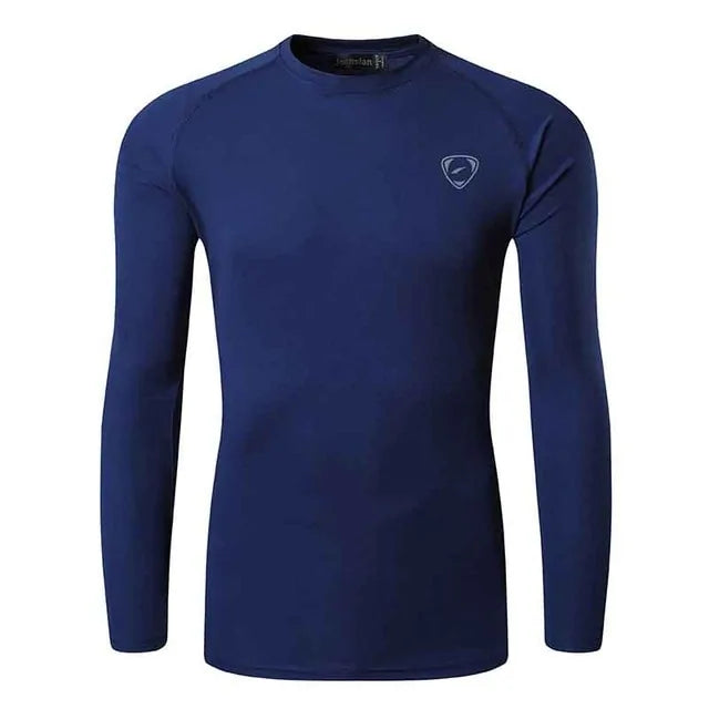 A sleek, light gray long-sleeve compression shirt with a crew neck, featuring a small logo on the upper left chest. The fabric appears smooth and stretchy, designed for athletic or casual wear.