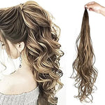 Split image showing a woman wearing a curly ponytail hair extension with brown hair and blonde highlights, and a hand holding the matching wavy ponytail piece on a white background.