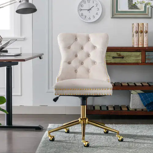 Beige office chair with gold legs in a home office setting