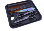 Haircutting tool kit in a zippered case, including two silver hair scissors (one thinning shears), a black comb, and a rainbow-finish straight razor, arranged on a black interior.