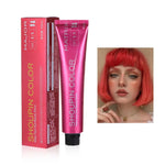 A tube of Shoupin Color hair dye in a pink box labeled “Make Your Hair Beauty Shine” and a picture of a person with bright red hair.