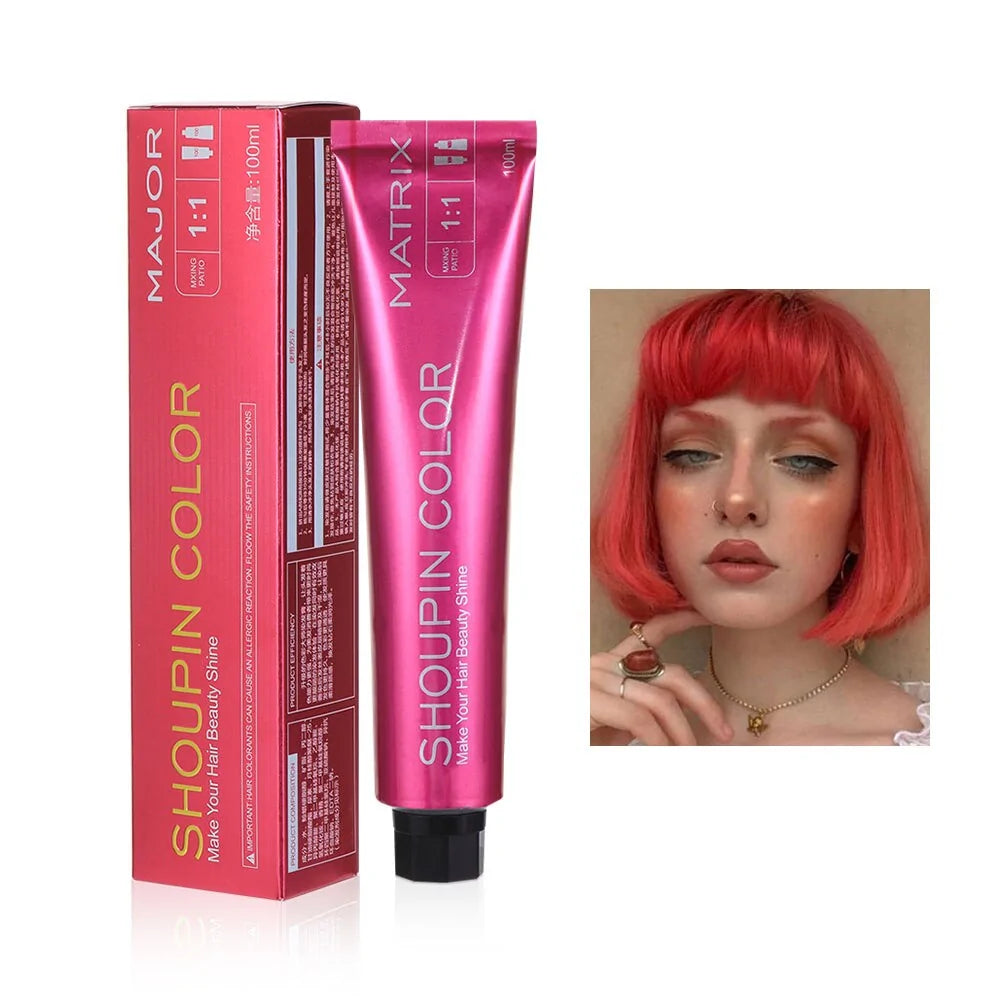 A tube of Shoupin Color hair dye in a pink box labeled “Make Your Hair Beauty Shine” and a picture of a person with bright red hair.