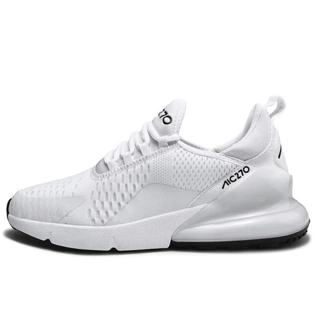 A black and dark gray athletic sneaker with a breathable knit upper, accented by bold orange wave-like stripes on the sides and orange detailing on the midsole. The shoe features a thick, textured sole and black-and-white patterned laces, designed for both style and performance.