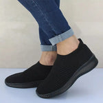 Black slip-on knitted trainers with ribbed soles