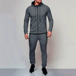 Men’s grey hooded tracksuit with zip-up top and ribbed joggers.