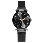 Black mesh-strap wristwatch with a round faceted bezel, a starry black dial with crystal hour markers, and rose-gold hands on a white background.