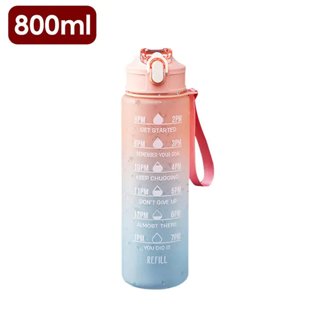 A tall 1000ml pink gradient water bottle with a silver screw cap and printed time markers down the front (e.g., 2pm–6pm) plus “Refill” near the bottom, shown on a white background.