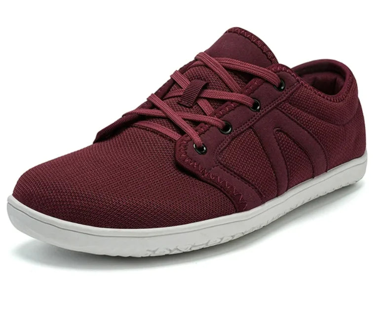 "Maroon-colored casual sneaker with a mesh fabric upper, lace-up design, black eyelets, and a white rubber sole.