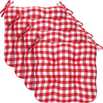 Set of four red and white checkered seat cushions on a white background