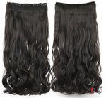 Two views of a long wavy medium-black clip-in hair extension piece shown on a white background—front on the left and the underside with a lace/clip band on the right—with text reading “Medium black.