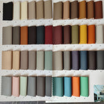 Collection of fabric swatches in various colors arranged in a grid.