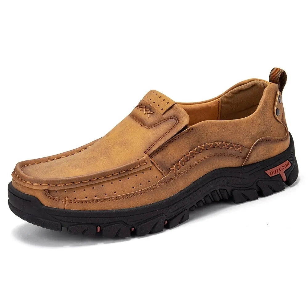Tan slip-on casual shoe with chunky black sole.