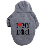 A pet hoodie with a hood and short sleeves, featuring the text 'I ❤️ MY DAD' printed on the back. The word 'Dad' includes a silhouette of a sitting dog integrated into the letter 'D'.