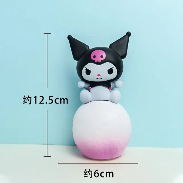 Small Kuromi-style figurine sitting on a round white-to-pink gradient base, shown with measurement markings indicating about 12.5 cm tall and 6 cm wide.
