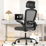 Black office chair in a room with a desk and decor items.