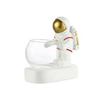 Astronaut figurine glass bowl desk planter.