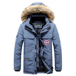 Blue insulated hooded parka with faux fur trim and multiple utility pockets.