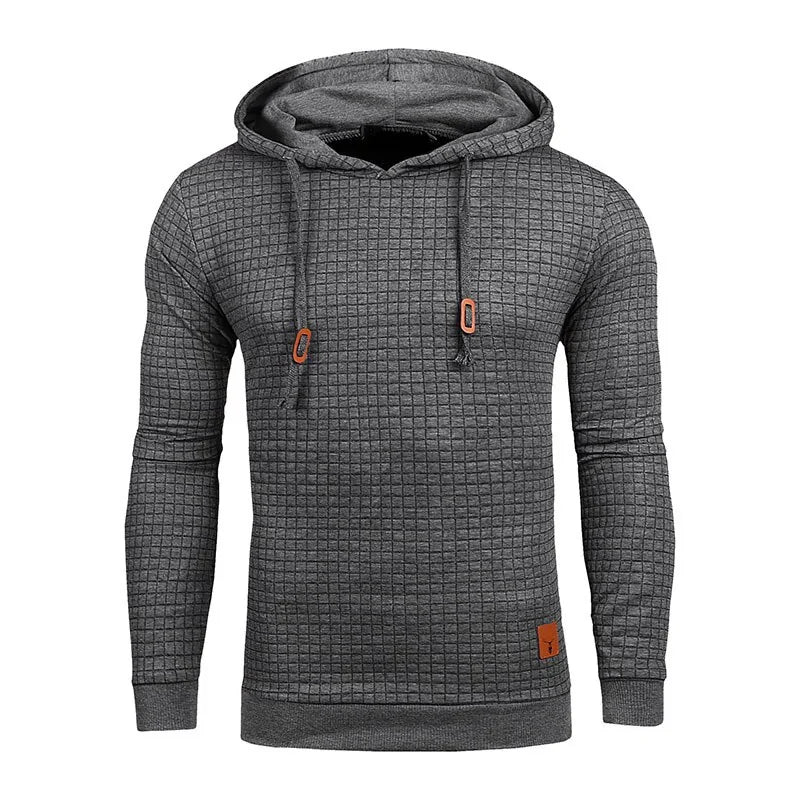 Grey textured pullover hoodie with a drawstring hood, ribbed cuffs and hem, and subtle orange trim details.
