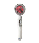 Handheld shower head with a transparent round top, visible red propeller blades, and a silver handle.