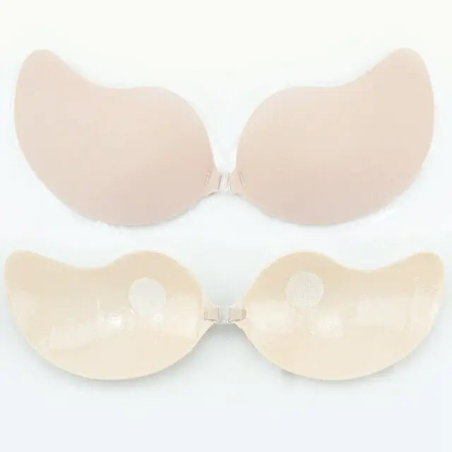 Beige stick-on bra with adhesive cups and front clasp fastening.